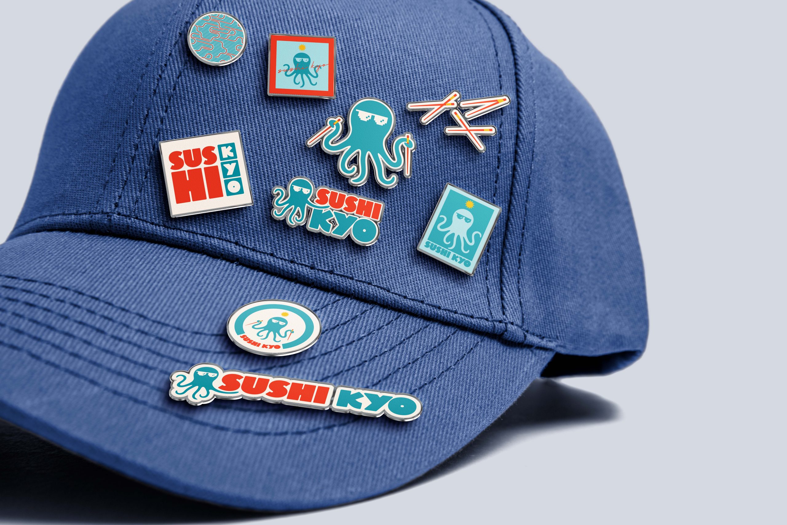 Sushi restaurant branding elements including logo pins and graphic icons