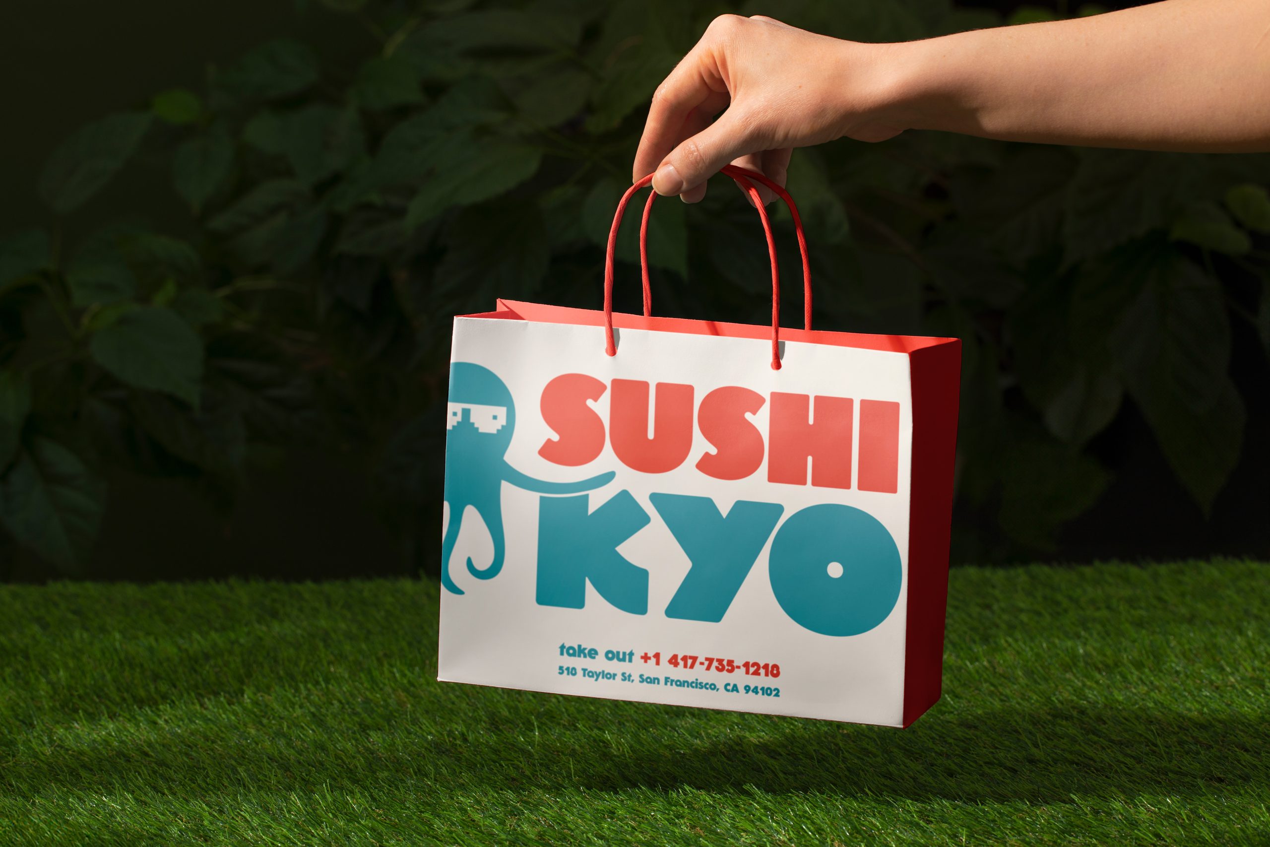 Branded sushi takeaway bag with bold typography and playful octopus logo for modern restaurant branding
