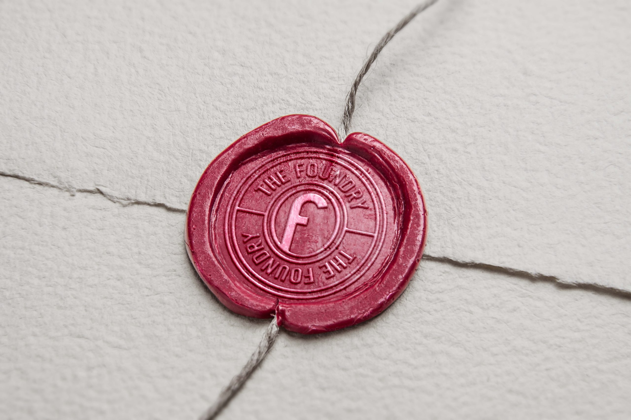 Custom wax seal featuring The Foundry Hotel monogram logo