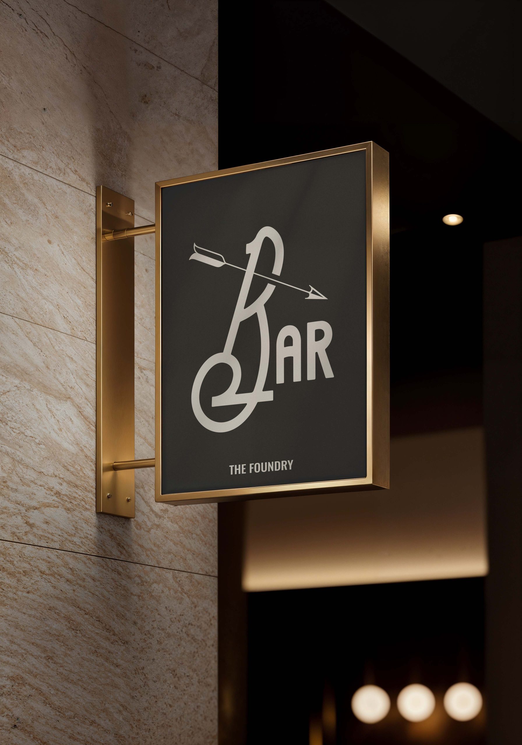 Hanging bar sign featuring custom typography and branding for The Foundry Hotel