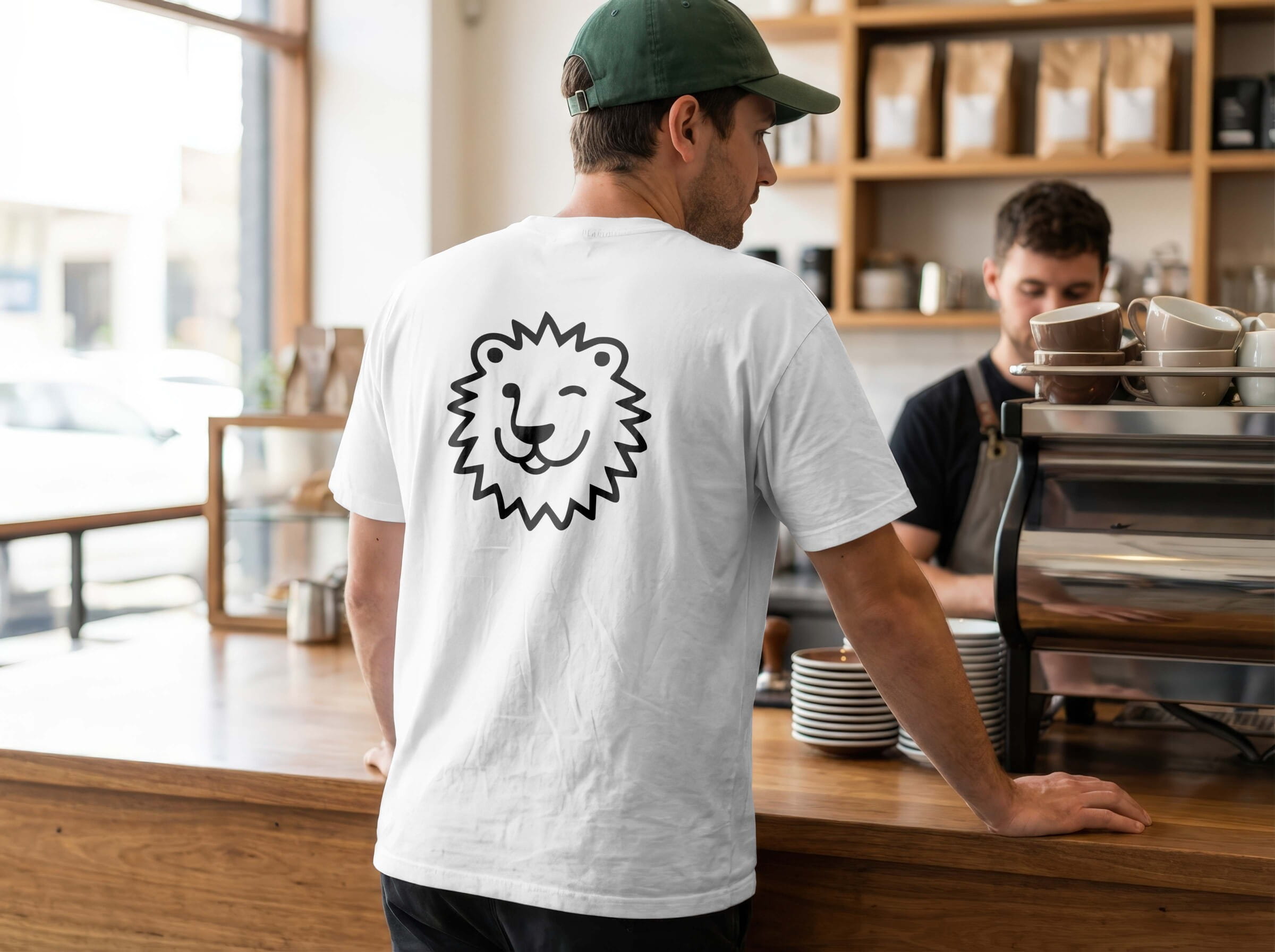 Leos Zapieksy branded staff T-shirt featuring the custom lion mascot