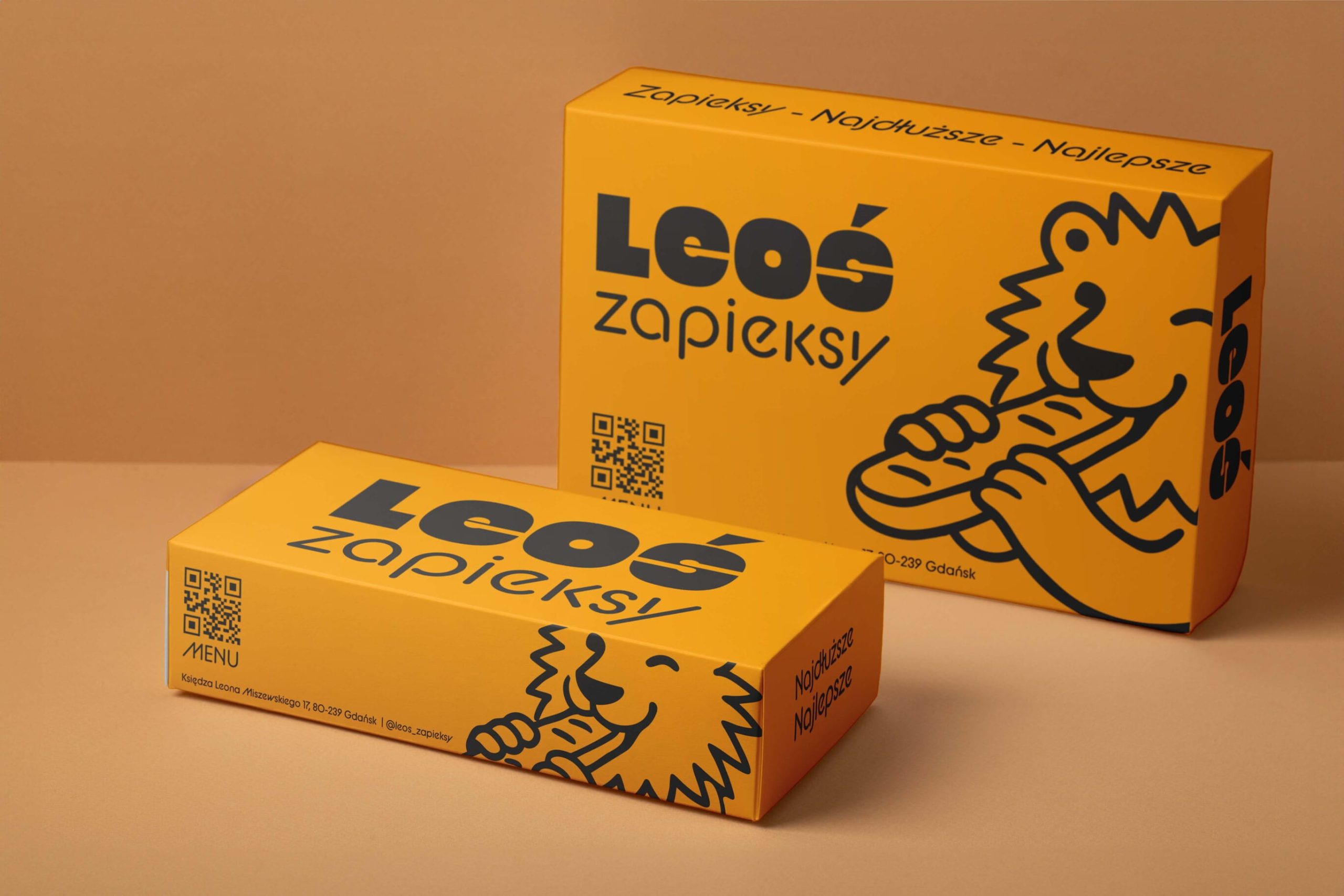 Leos Zapieksy branded takeaway food boxes with custom lion illustration